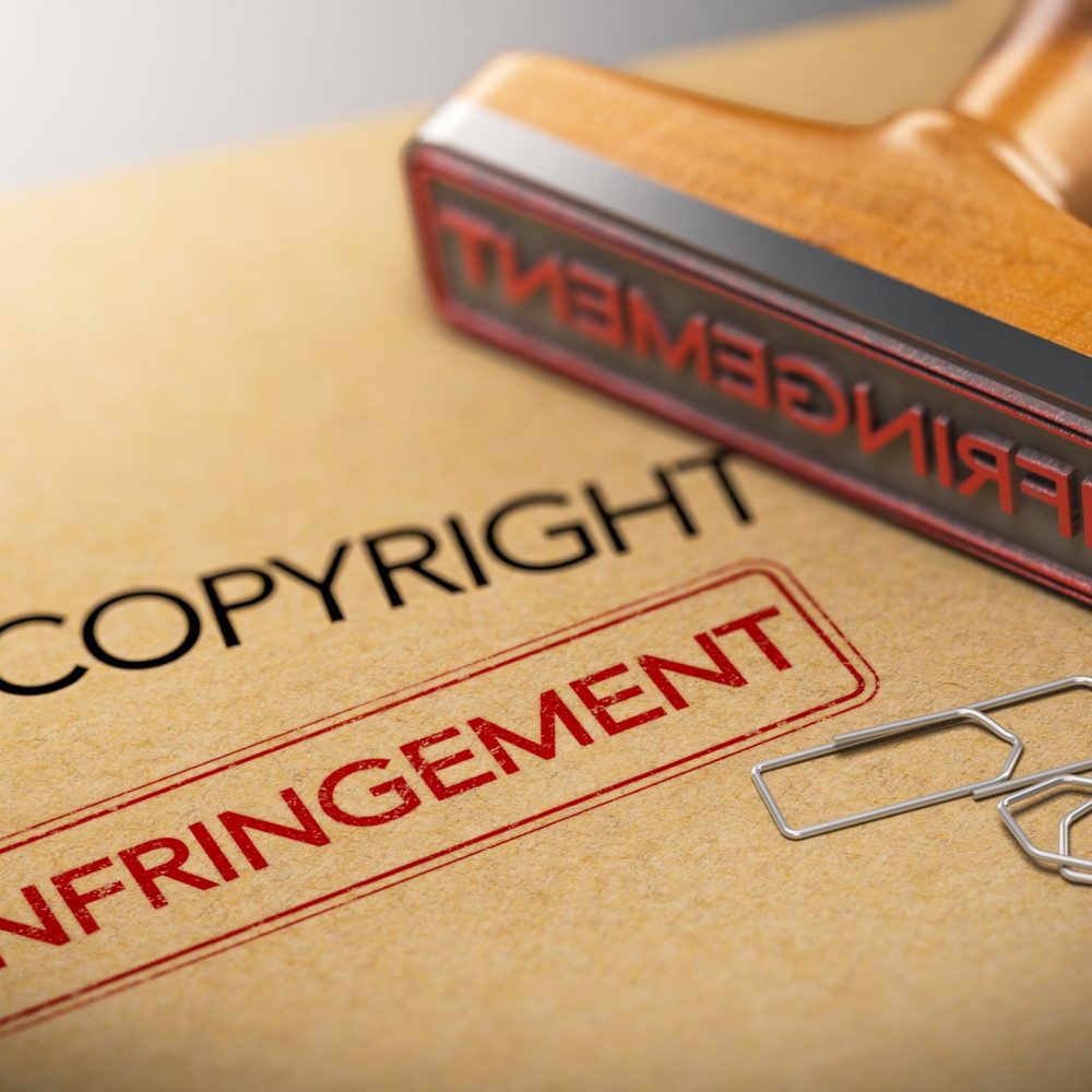 3D illustration of rubber stamp with the words copyright and infringement over kraft paper background, Concept of intellectual property.